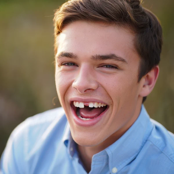 The guy knocked out his tooth while playing