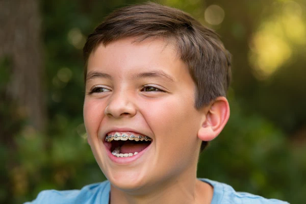 Smiling boy with braces
